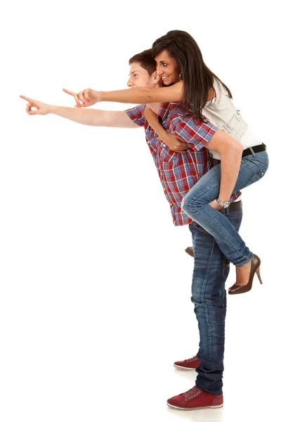 Young man carrying his cute girl on back — Stock Photo, Image