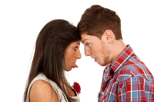 Woman sticking out her tongue at man — Stock Photo, Image