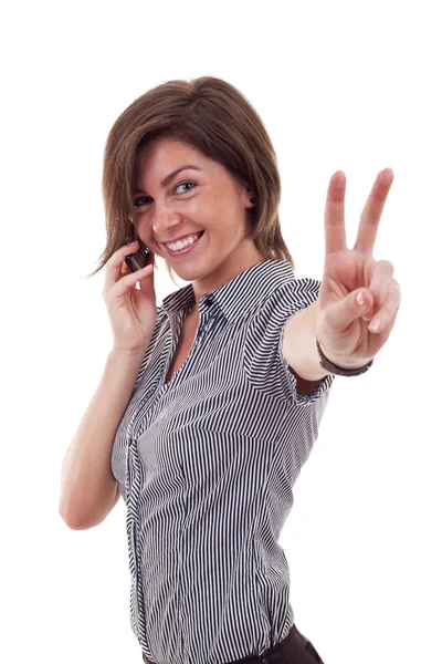 Деловая женщина с телефоном и победным жестом — стоковое фото