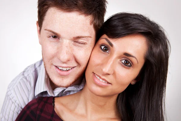 Young couple embracing and smiling — Stock Photo, Image