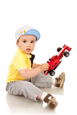 Boy playing with his toy car clipart