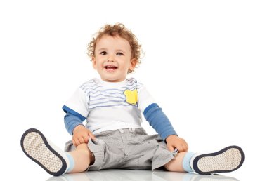 Boy sitting and smiling clipart