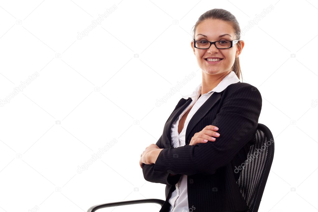 Business woman sitting in office chair with arms crossed
