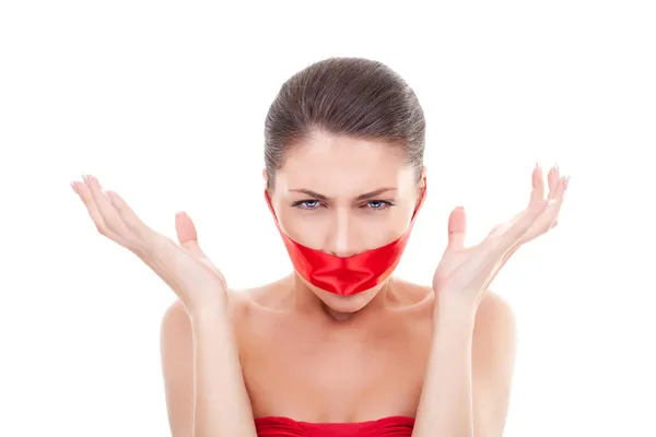 Angry woman with mouth covered — Stock Photo, Image
