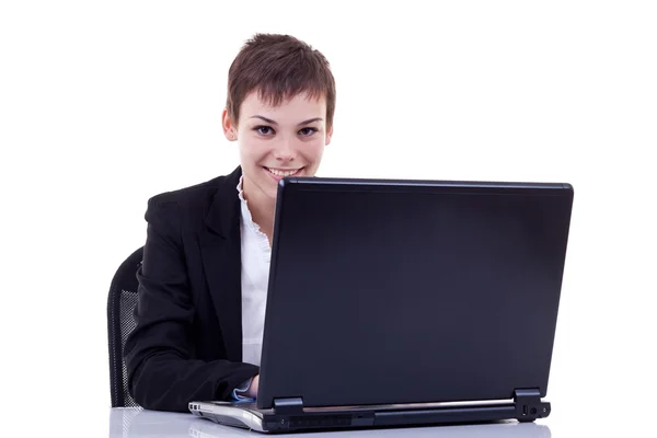 Деловая женщина работает на ноутбуке Стоковая Картинка