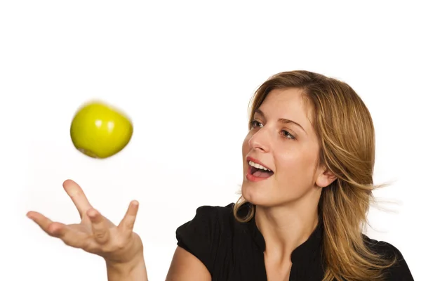 Jonge vrouw met groene vruchten op witte achtergrond — Stockfoto