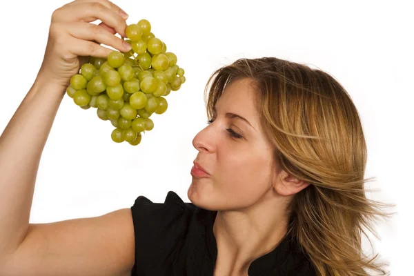 Stock image Young woman holding green fruit over white background