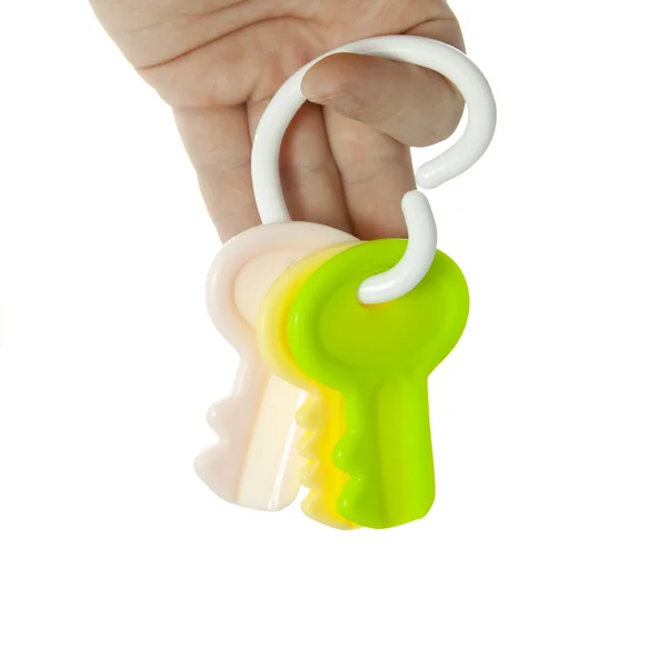 A mão está segurando chaves de brinquedo — Fotografia de Stock