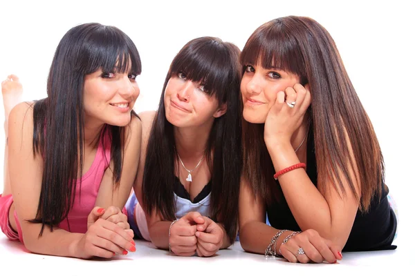 Grupo de tres niñas que ponen — Foto de Stock