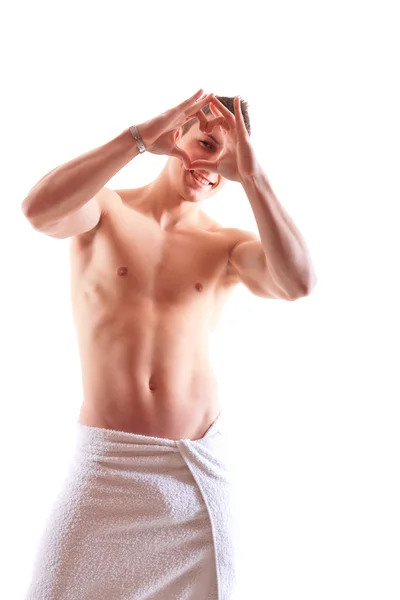 Beautiful muscular man with the towel. — Stock Photo, Image