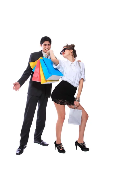 ショッピングのカップルは、笑みを浮かべてします。白い背景の上の分離 — ストック写真