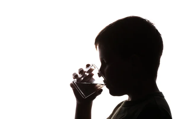 Child drinking glass of water — Stock Photo, Image