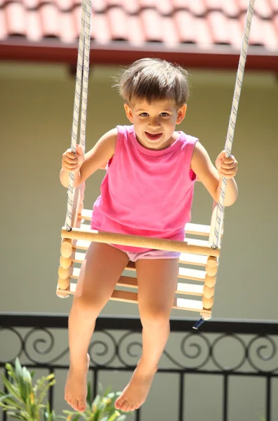 Child swinging — Stock Photo, Image