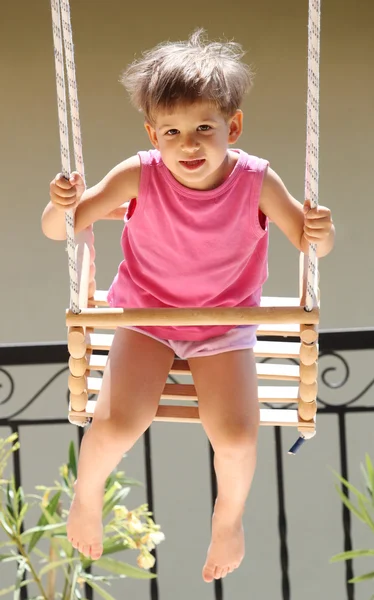 Child swinging — Stock Photo, Image