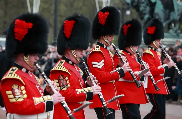 Queens guards marching and playing music Stock Photo