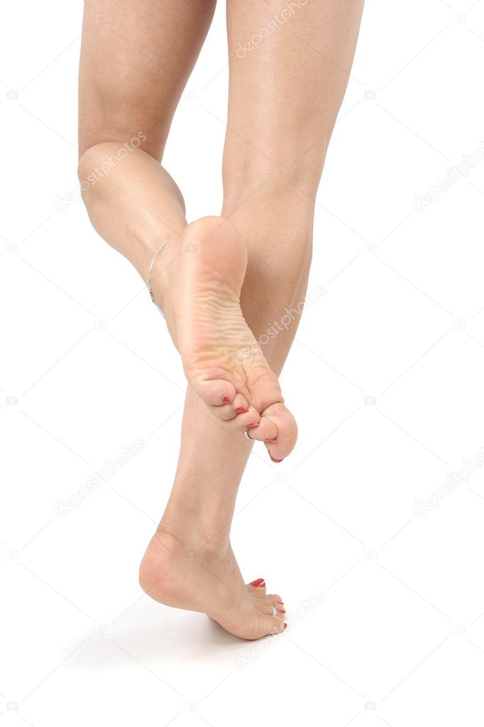 Woman legs and feet isolated over white