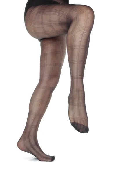 Frau Beine tragen Strumpfhosen über weißem Hintergrund — Stockfoto