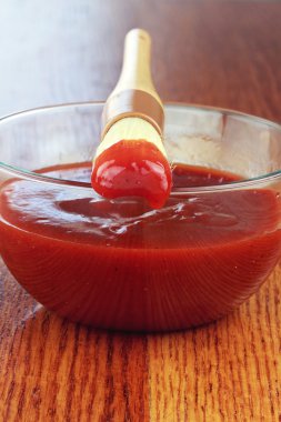 Basting Brush and Bowl of Barbecue Sauce clipart