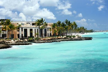 Luxury hotel complex and coastline on Cap Cana seaside clipart