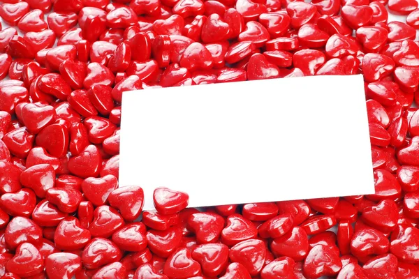 Valentines corazones de caramelo con tarjeta en blanco —  Fotos de Stock