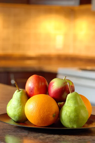 Fruit on a wooden plate — Stock Photo, Image