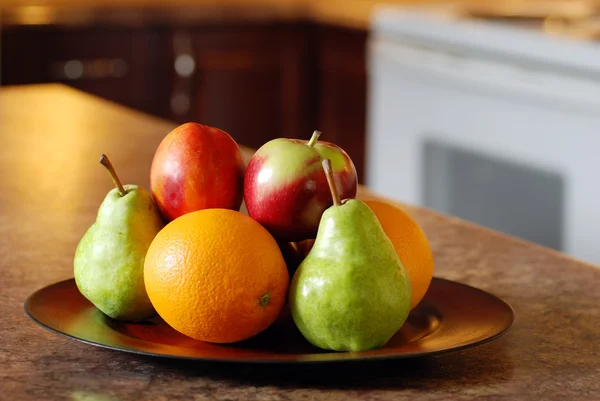 Mixed fruit on wood plate — Stock Photo, Image