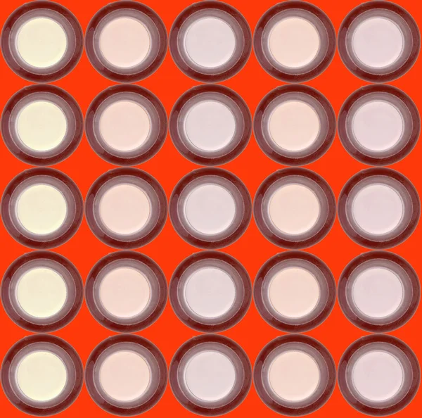 Láhev s caps izolovaných na oranžové — Stock fotografie