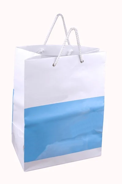Белый синий бумажный пакет — стоковое фото