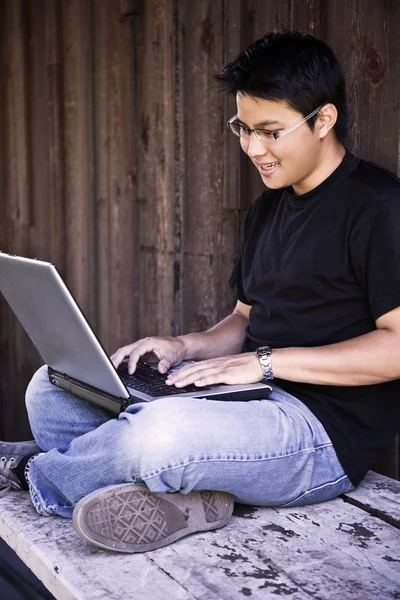 Asian college student with laptop