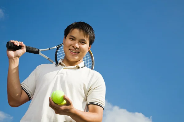 Asian male playing tennis — Stock Photo, Image