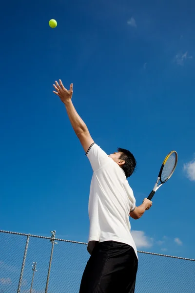 Asian playing tennis — Stock Photo, Image