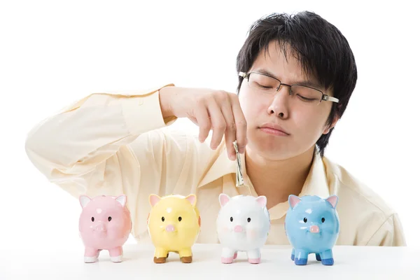 Aziatische zakenman geld te besparen — Stockfoto