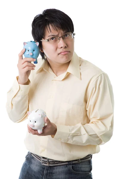 Asiatischer Geschäftsmann mit Sparschweinen — Stockfoto