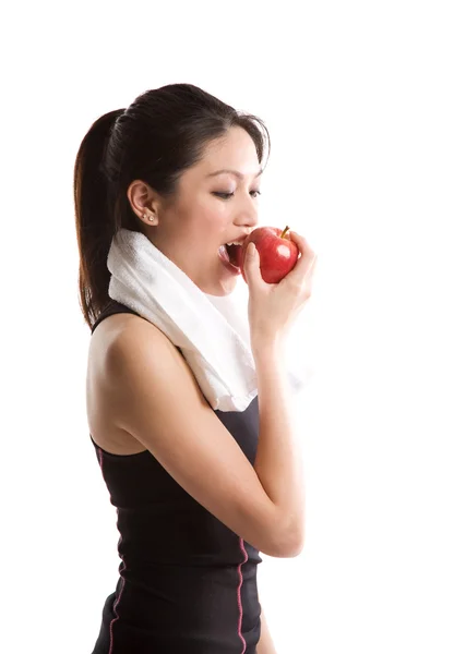 Asiática chica ejercicio y comer manzana — Foto de Stock
