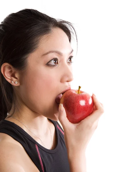 Asijské dívky jíst jablko — Stock fotografie