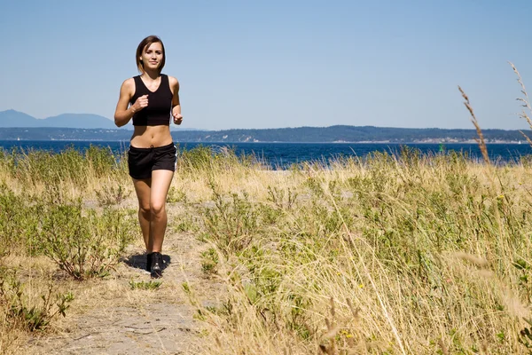 Sporty caucasian girl running — Stock Photo, Image
