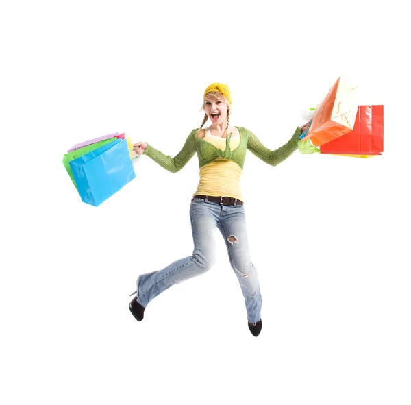 Happy caucasian girl jumping with shopping bags — Stock Photo, Image