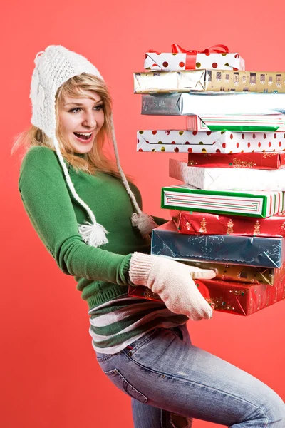 Caucasian girl with gifts on holiday — Stock Photo, Image