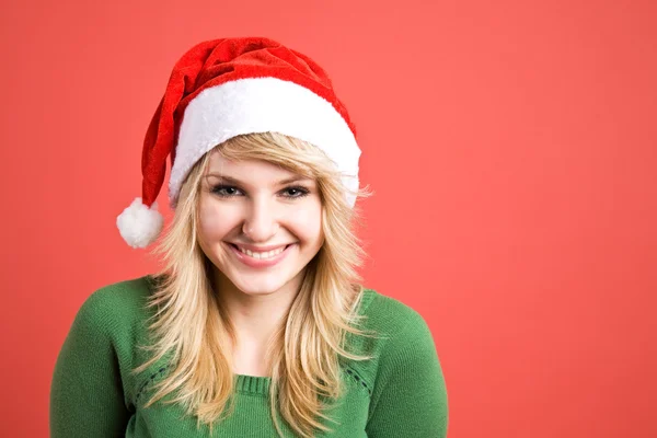 Beyaz kız giyen Noel Baba şapkası — Stok fotoğraf