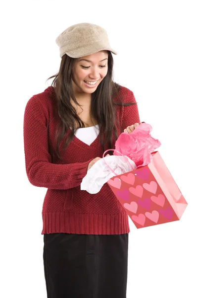 Asian girl opening valentine gift — Stock Photo, Image