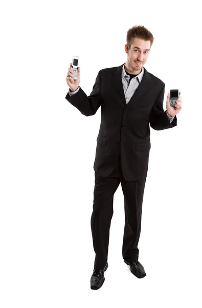 Caucasian businessman with cell phones — Stock Photo, Image