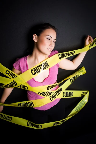 Businesswoman in caution tape — Stock Photo, Image