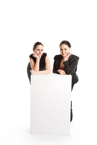 Geschäftsfrauen mit Werbetafel — Stockfoto