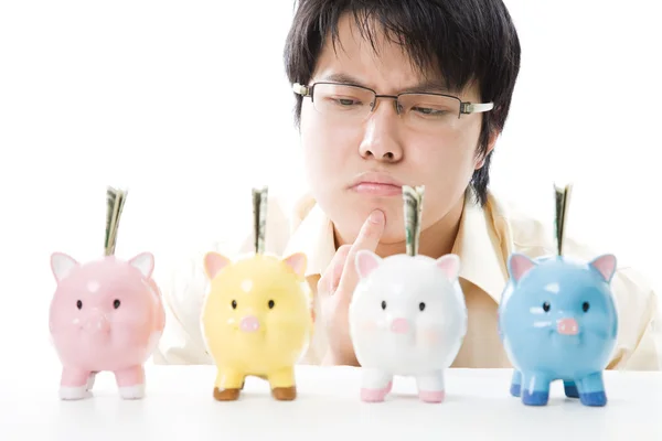 Asian businessman saving money — Stock Photo, Image