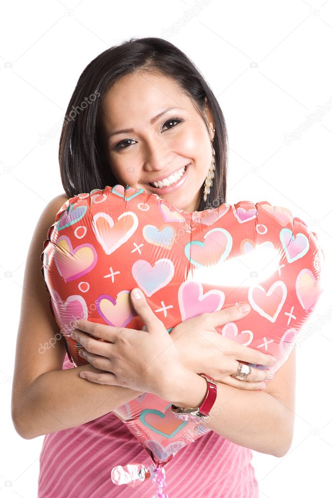 Asian woman with heart-shaped balloon