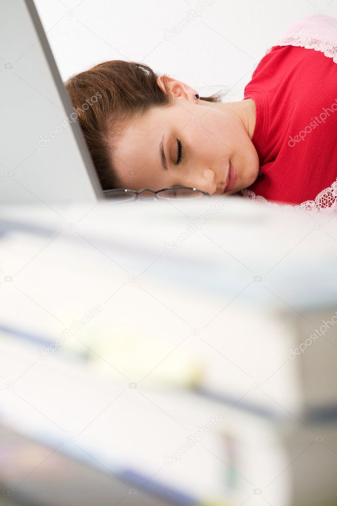Sleeping caucasian female student