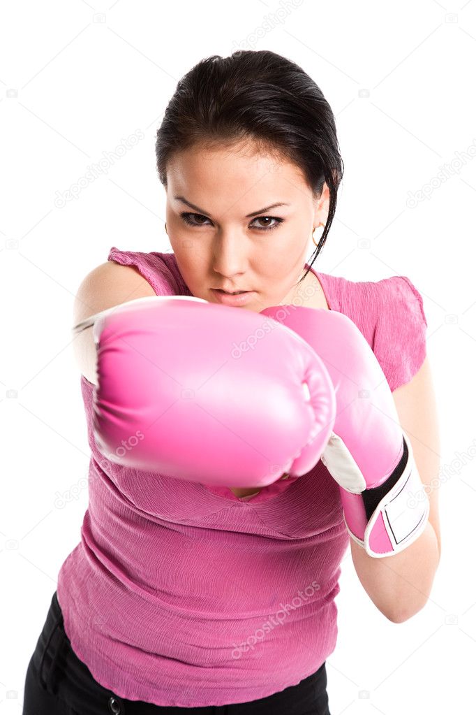 Businesswoman punching with boxing gloves
