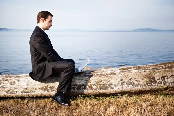 Caucasian businessman with laptop — Stock Photo, Image