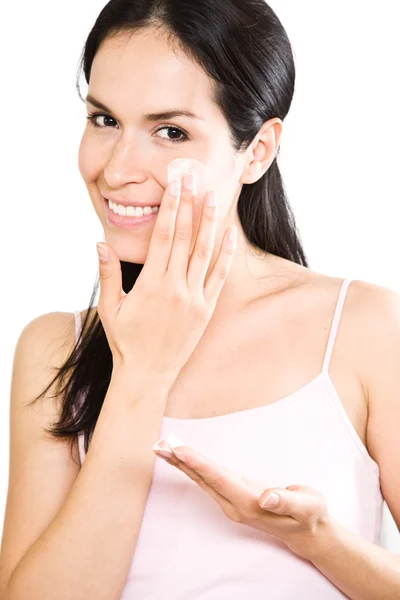 Woman applying lotion — Stock Photo, Image