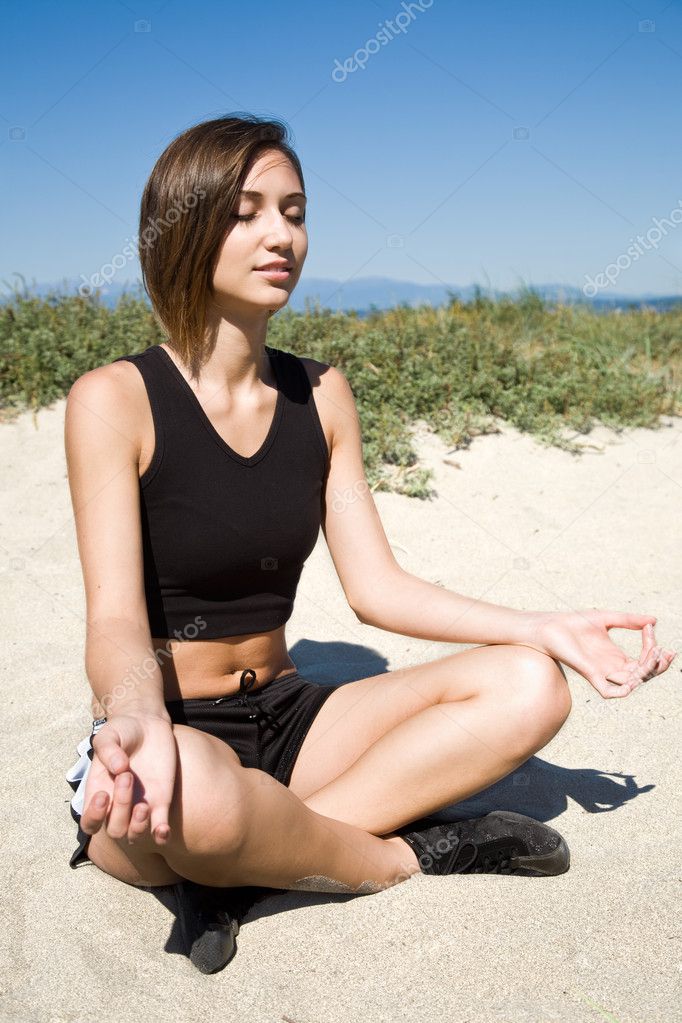 Yoga girl on the beach